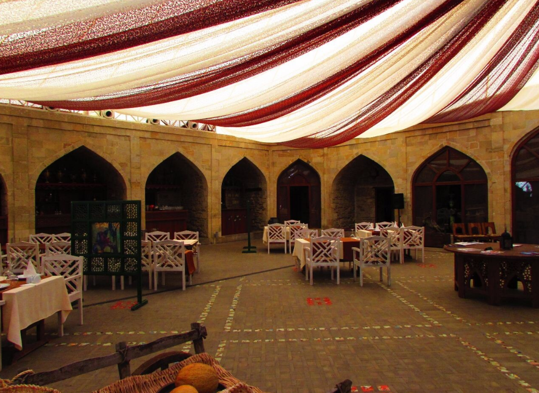 View of a historical caravanserai at night in Baku