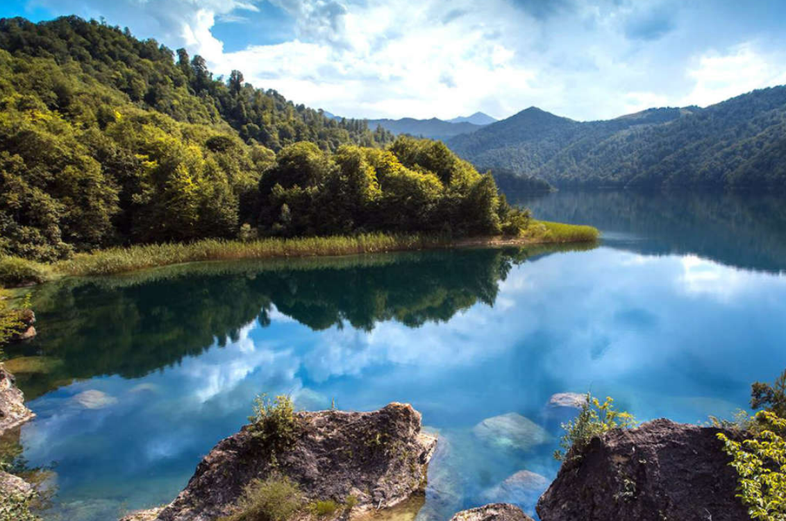 Relaxing atmosphere at Chenlibel Lake with mountains in the distance