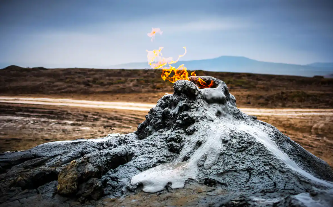 Mud volcano bubbling with clay and mud