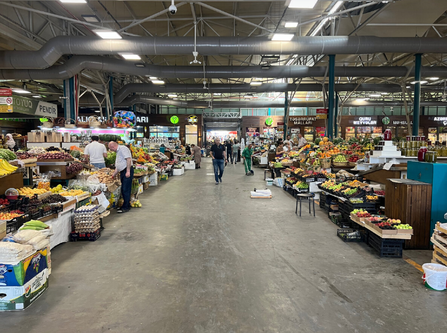 Colorful stalls filled with fresh produce at Yashil-Bazar